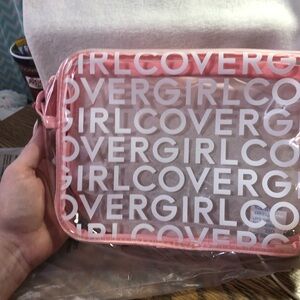 Covergirl pink and clear logo print zippered bag with strap